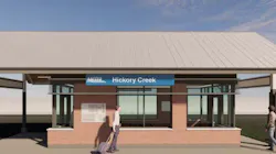 An architectural rendering of a new Metra Hickory Creek station building, featuring a low-pitched metal roof, brick base, large glass windows, and a blue Metra station sign, with two pedestrians depicted approaching the entrance.