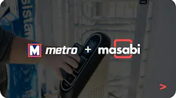 A promotional graphic displaying the logos of St. Louis Metro and Masabi side by side, overlaid on a background image of a hand holding a Justride fare validation device at a transit station.