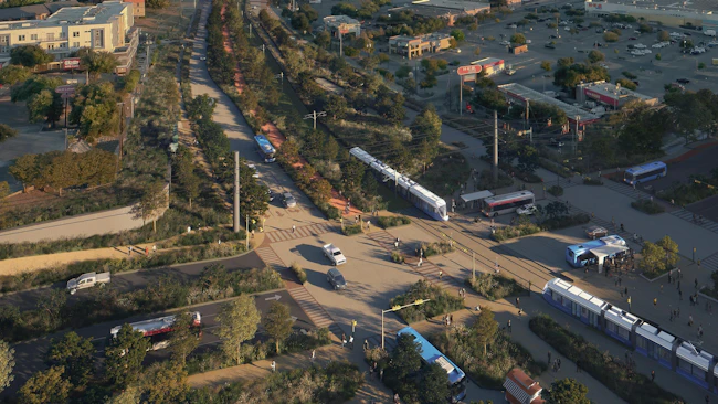 A rendering of Austin's future light rail line along Pleasant Valley Road, showing a modern white and blue light rail vehicle traveling alongside a landscaped multi-use path and roadway, with strip-mall retail and parking lots to the sides and the downtown Austin skyline in the distance at dusk.