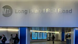 The MTA LIRR logo appears on a wall above arrivals displays.