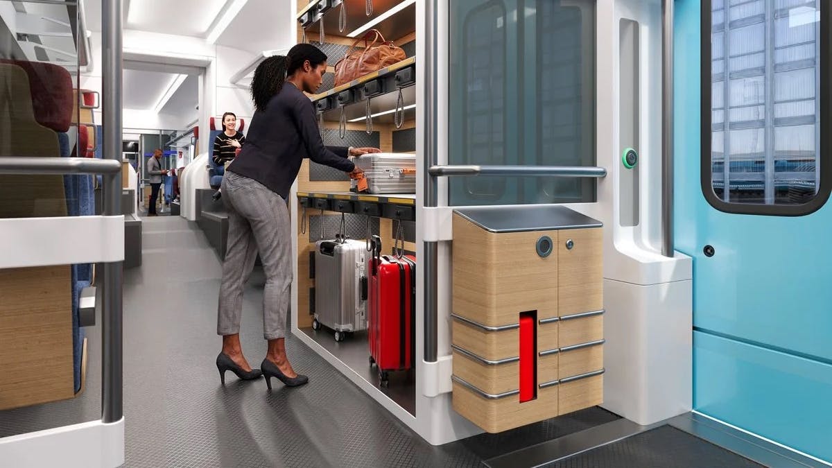 Rendering of a proposed Chicago Flyer train car interior showing an onboard luggage storage compartment, where a passenger loads a suitcase onto a shelf beside secured storage lockers and rolling bags.