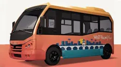 Rendering of a West Palm Beach transit shuttle in coral and yellow livery, featuring a stylized skyline and palm tree graphic on the side panel.