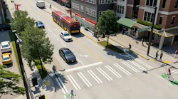 Aerial rendering of a redesigned street intersection at East Lynn Street, featuring a red articulated bus stopped at a curbside shelter, dedicated bike lanes, raised medians with trees, and pedestrians and cyclists crossing at a signalized intersection.