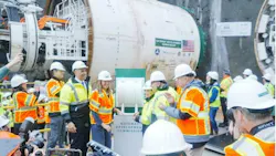 A crowd of officials and media gathers around a large tunnel boring machine marked with Gateway Development Commission branding, with someone about to press a ceremonial button to launch boring.