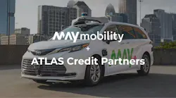 A May Mobility autonomous vehicle is shown with a city skyline in the background, overlaid with text announcing a partnership between May Mobility and ATLAS Credit Partners.
