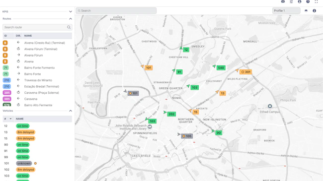 A screenshot of Optibus's Real-Time Suite dashboard shows a map of Manchester, England, with color-coded bus markers and side panels listing routes and vehicle statuses such as 'on time' and '8m delayed.'
