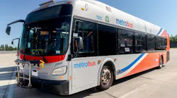 A WMATA NFI bus is photographed from a diagonal angle showing its livery.