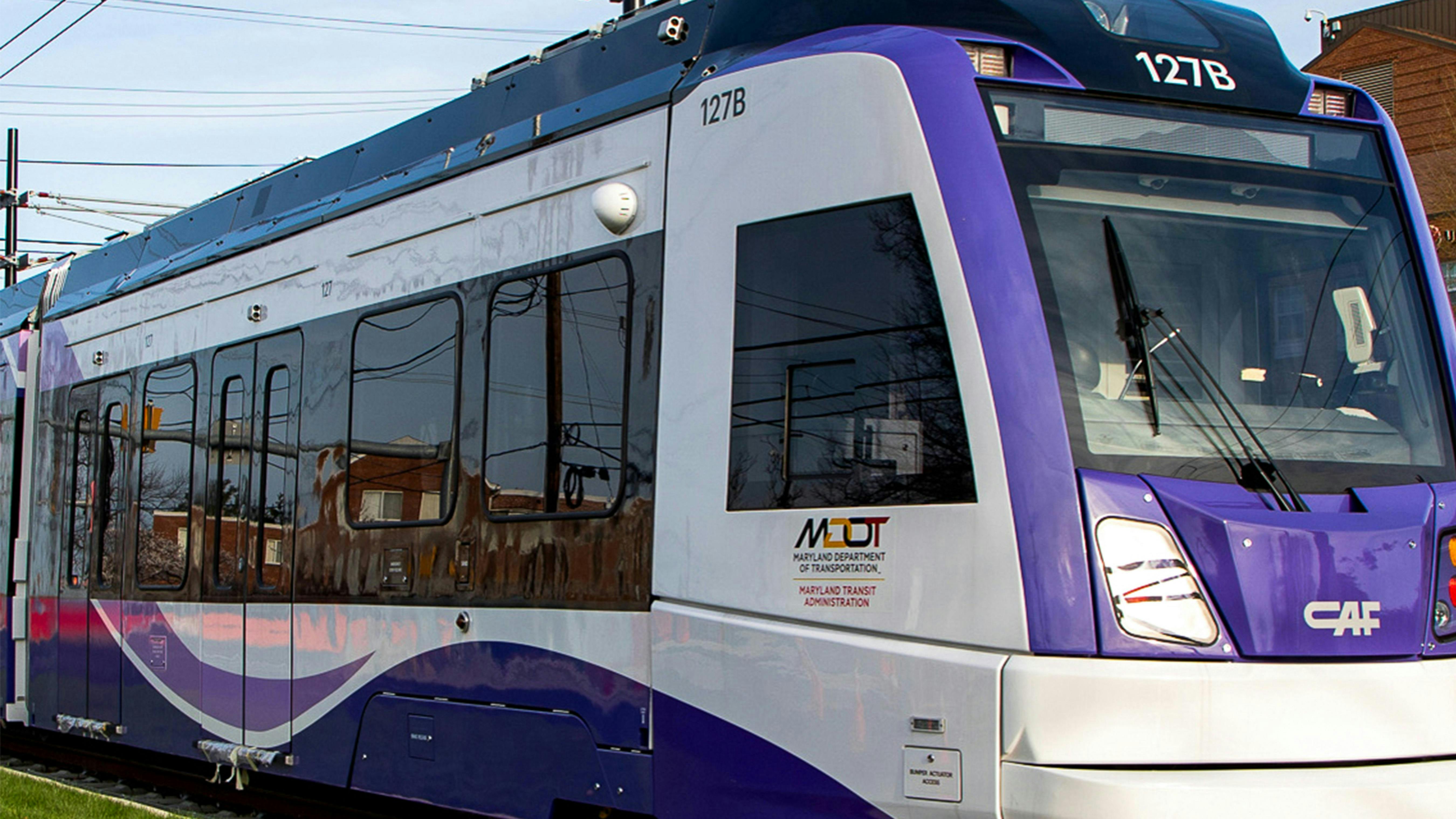 An up close shot of a a Purple Line LRV at Adelphi Road&ndash;UMGC&ndash;UMD station.