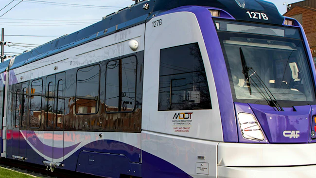 An up close shot of a a Purple Line LRV at Adelphi Road&ndash;UMGC&ndash;UMD station.