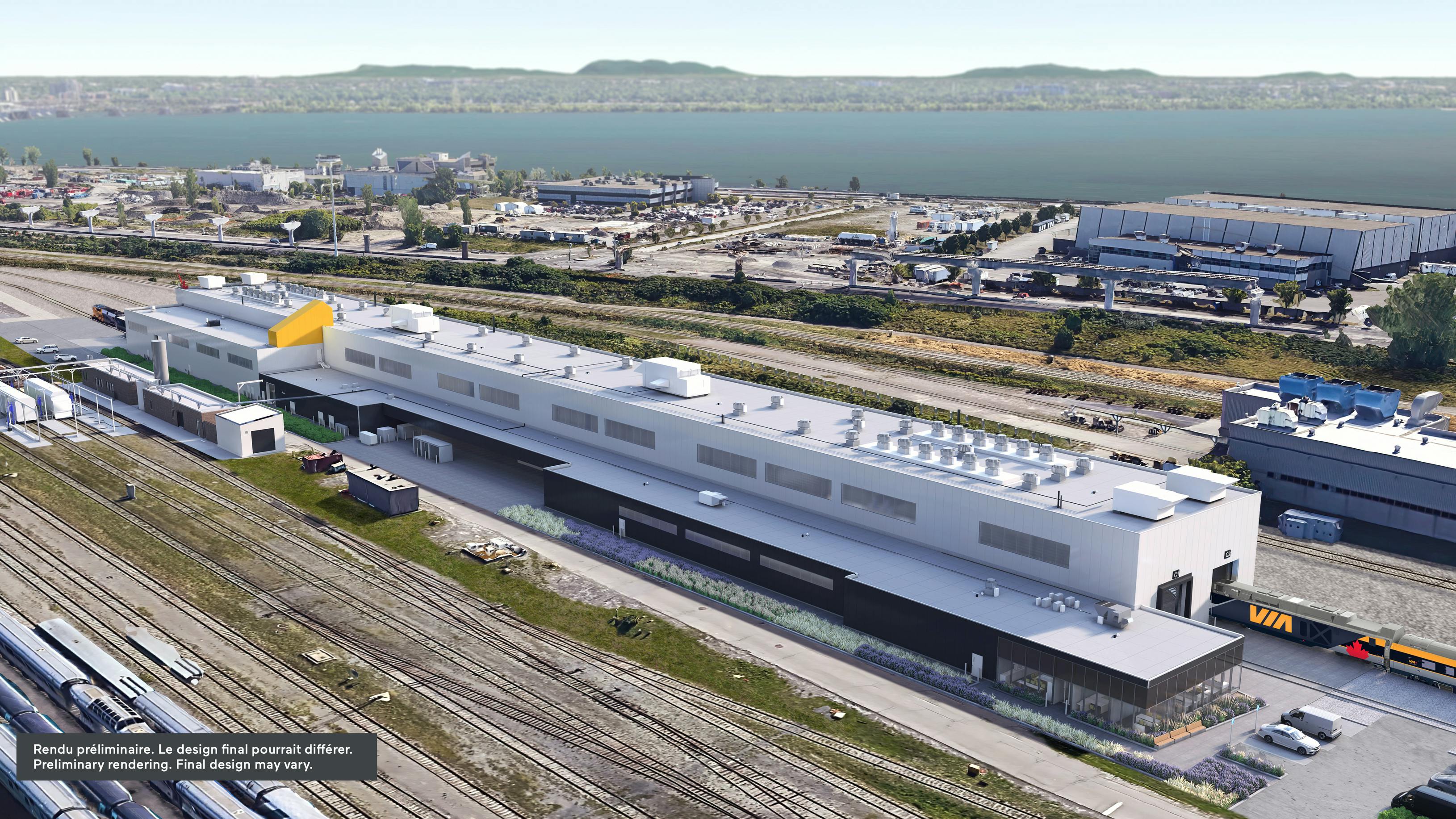 Aerial rendering of a planned VIA Rail maintenance facility, a long white and dark gray building beside rail tracks, with a watermark reading &lsquo;Preliminary rendering. Final design may vary.