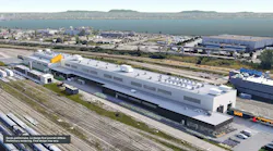 Aerial rendering of a planned VIA Rail maintenance facility, a long white and dark gray building beside rail tracks, with a watermark reading ‘Preliminary rendering. Final design may vary.