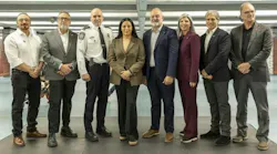 Eight people stand in a row for a group photo indoors, including a uniformed police official, with Aydin Matlabi, Jim Beis, Cédric Couture, Soraya Martinez Ferrada, Aref Salem, Marie-Claude Léonard, Martin Prud’homme and Guy Langlois pictured left to right.