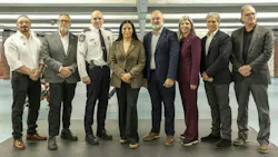 Eight people stand in a row for a group photo indoors, including a uniformed police official, with Aydin Matlabi, Jim Beis, Cédric Couture, Soraya Martinez Ferrada, Aref Salem, Marie-Claude Léonard, Martin Prud’homme and Guy Langlois pictured left to right.